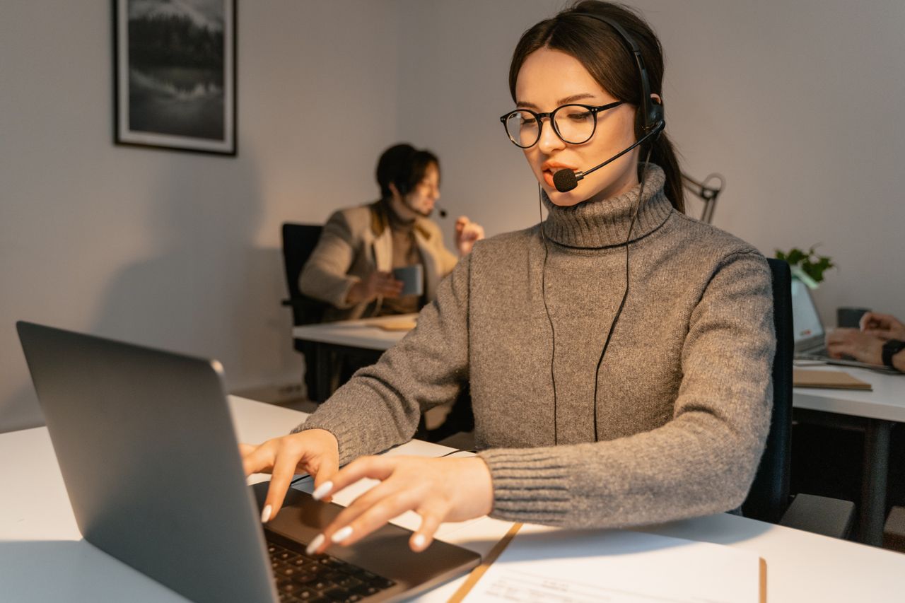 The Art of Drawing Readers In: Your attractive post title goes here Two call center agents providing customer service in a modern office environment.